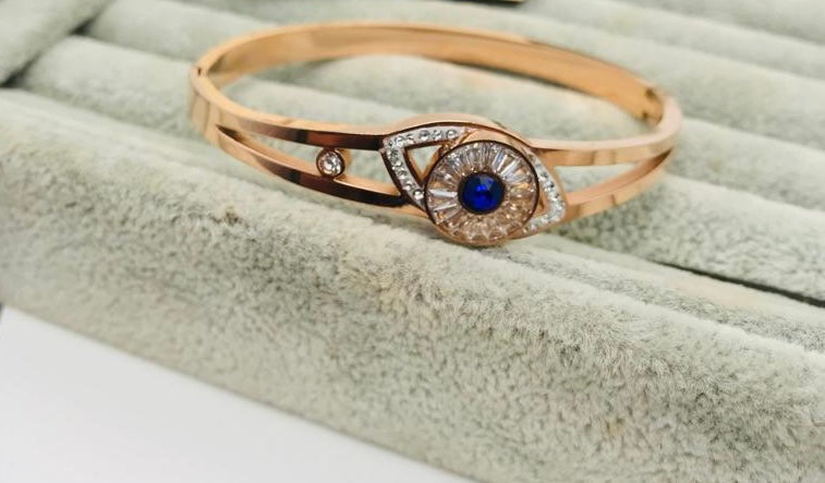 Evil eye crystal and blue stone studded bracele
